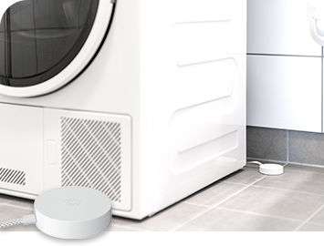 Pesukone, jonka takana on Verisuren vuotovahti. Etualalla Verisuren vuotovahti.