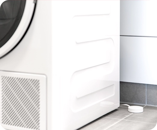 Verisuren vesi- ja vuotovahti pesukoneen takana.