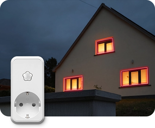 Taustalla talon valaistut ikkunat iltahämärässä, etualalla Verisuren älypistorasia.