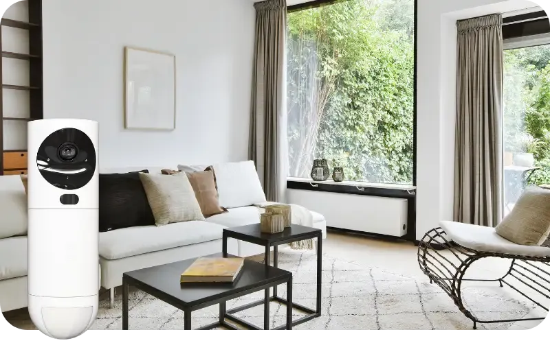 Olohuone taustalla ja GuardVision-valvontakamera kuvan etualalla.
